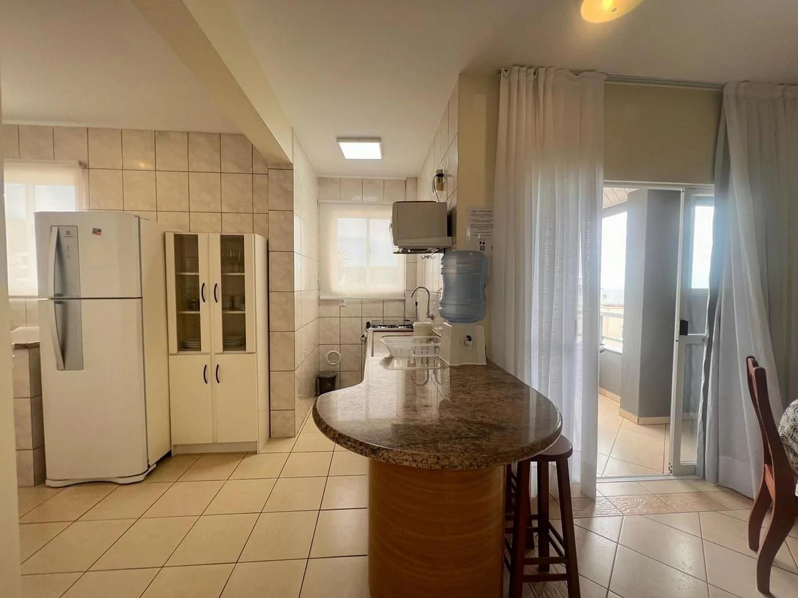 Foto oficial · Vista Bella — Apartamento 301, 1 dormitório, lateral · 16